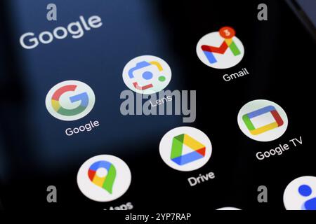 In this photo illustration, Google, Google Lens, Gmail, Maps, Drive, and Google TV apps displayed on your smartphone screen Stock Photo