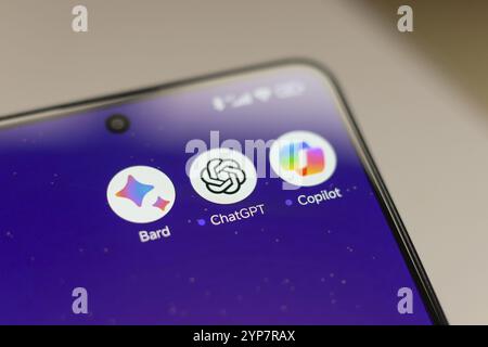 In this photo illustration, Google Bard, ChatGPT and Copilot apps displayed on a smartphone screen Stock Photo