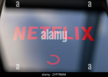 In this photo illustration, the Netflix streaming app logo is displayed on the smartphone screen Stock Photo