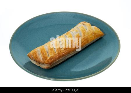 Large sausage roll on a plate - white background Stock Photo