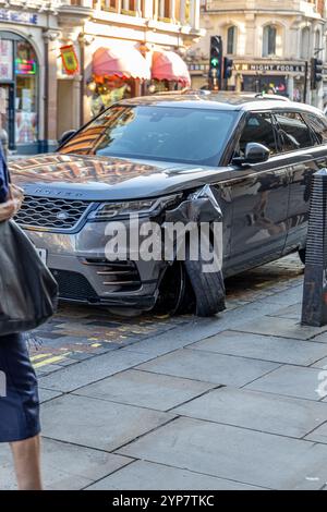 London, UK- September 19, 2024: Damaged Range Rover with significant front-end collision, showing urban street accident impact on vehicle in London. Stock Photo