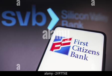 In this photo illustration the First Citizens Bank logo seen displayed on a smartphone and Silicon Valley Bank (SVB) logo on the background Stock Photo