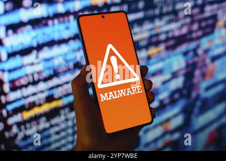 In this photo illustration, the Malware icon is displayed on a smartphone screen Stock Photo