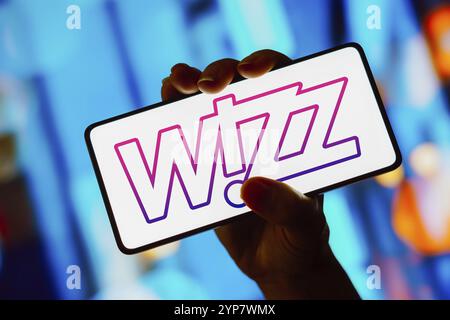 In this photo illustration, the Wizz Air logo is displayed on a smartphone screen Stock Photo