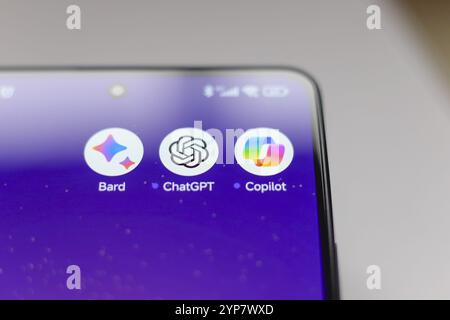 In this photo illustration, Google Bard, ChatGPT and Copilot apps displayed on a smartphone screen Stock Photo