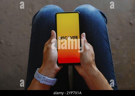 In this photo illustration a Discover logo of Discover Financial