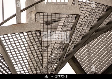 Details of a metal spiral staircase in an industrial building Stock Photo