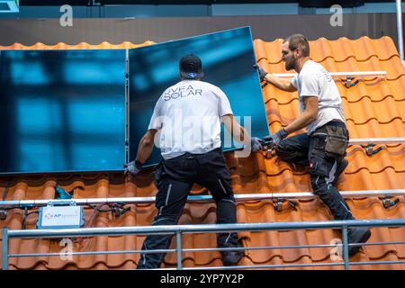 Presentation of the rapid installation of a solar system on a residential house with a pitched roof, in the form of a competition, European Solar Game Stock Photo