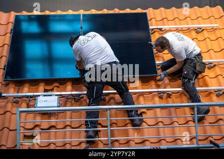 Presentation of the rapid installation of a solar system on a residential house with a pitched roof, in the form of a competition, European Solar Game Stock Photo