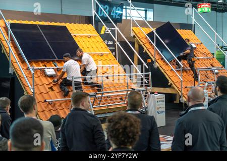 Presentation of the rapid installation of a solar system on a residential house with a pitched roof, in the form of a competition, European Solar Game Stock Photo