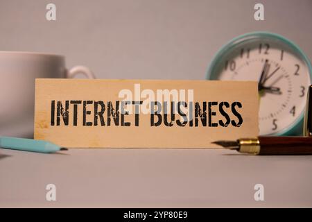 Happy mature older male entrepreneur standing outdoors looking at smartphone. Smiling middle aged business man, rich professional businessman holding Stock Photo
