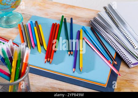 Colored pencils kept in pencil holder Stock Photo