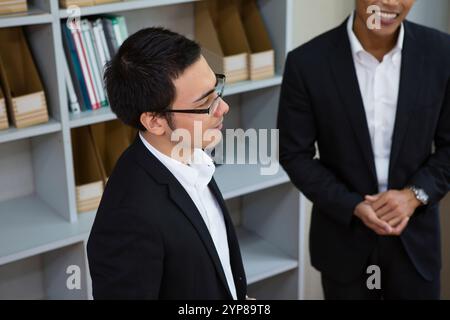 Businessmen chatting and laughing Stock Photo