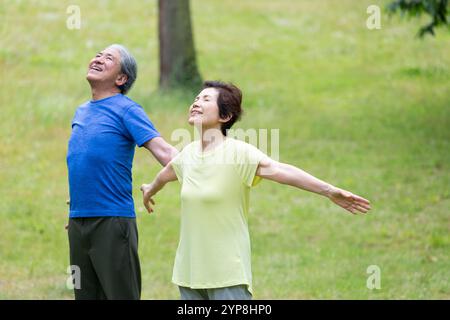 Senior couple taking a deep breath Stock Photo
