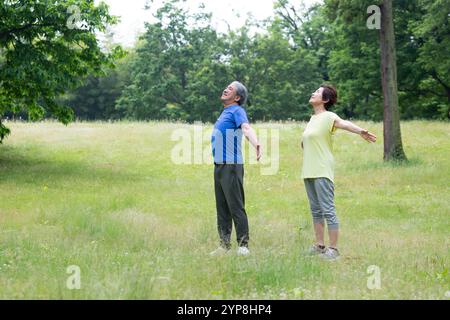 Senior couple taking a deep breath Stock Photo