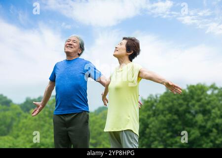 Senior couple taking a deep breath Stock Photo