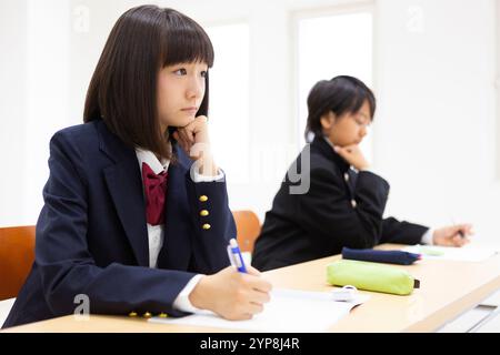 Junior high school students studying at a cram school Stock Photo