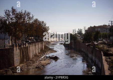 Valencia, Spain. 28th Nov, 2024. The Barranco del Poyo in the town of Massanassa south of Valencia. On November 29, one month has passed since the Isolated Depression at High Levels (DANA) that hit the towns in the south of the Spanish city of Valencia at the end of October and which, in addition to causing millions in economic damages, claimed the lives of more than 200 people. Credit: SOPA Images Limited/Alamy Live News Stock Photo