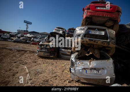 Valencia, Spain. 28th Nov, 2024. Hundreds of useless cars piled up in the town of Alfafar south of Valencia. On November 29, one month has passed since the Isolated Depression at High Levels (DANA) that hit the towns in the south of the Spanish city of Valencia at the end of October and which, in addition to causing millions in economic damages, claimed the lives of more than 200 people. Credit: SOPA Images Limited/Alamy Live News Stock Photo