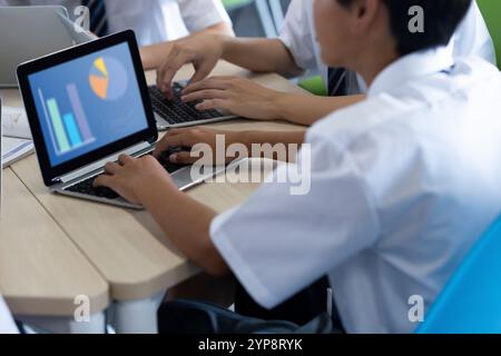 Junior high school students doing group work Stock Photo