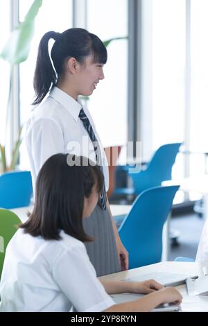 Junior high school students doing group work Stock Photo