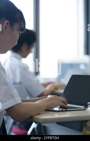 Junior high school pupils in class Stock Photo - Alamy
