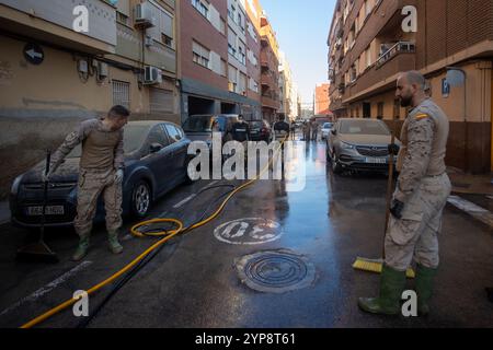 Valencia, Spain. 28th Nov, 2024. Army personnel clean the streets of Paiporta in the south of Valencia. On November 29, one month has passed since the Isolated Depression at High Levels (DANA) that hit the towns in the south of the Spanish city of Valencia at the end of October and which, in addition to causing millions in economic damages, claimed the lives of more than 200 people. (Photo by David Canales/SOPA Images/Sipa USA) Credit: Sipa USA/Alamy Live News Stock Photo