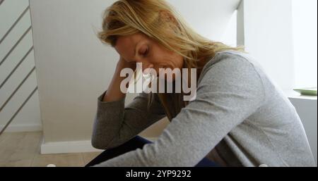 Worried woman relaxing at home 4k Stock Photo