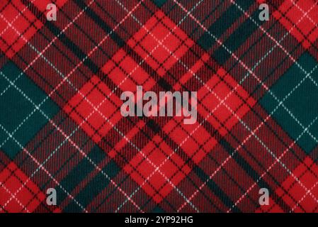 Christmas Tartan Plaid Design Checkered plaid. Cloth Pattern background of Scottish style. new year textile decorations, top view. Stock Photo