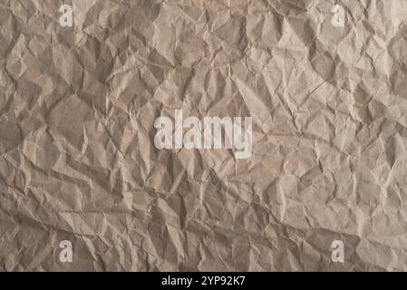 Beige crumpled paper texture, Abstract background high resolution. Stock Photo