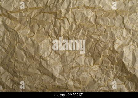 Golden crumpled paper texture, Abstract background high resolution. Stock Photo