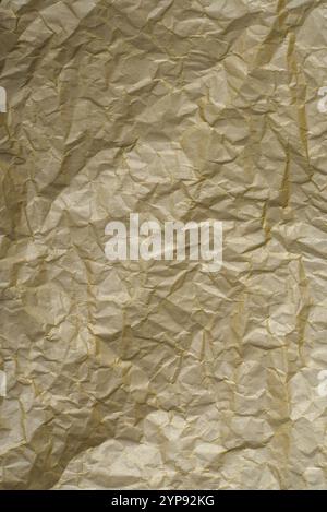 Golden crumpled paper texture, Abstract background high resolution. Stock Photo