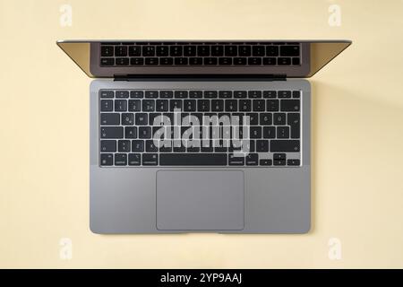Top view of laptop isolated on yellow background Stock Photo