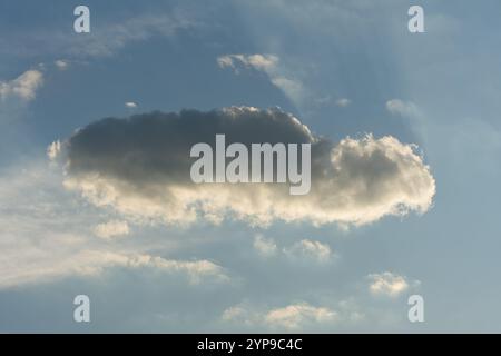 A lost cloud against a blue sky Stock Photo