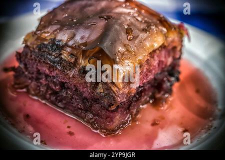 A closeup photo of a tasty and juicy homemade cherry pie on a plate Stock Photo