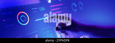 Hand interacting with comprehensive business dashboard displaying various data insights and performance graphs. Stock Photo