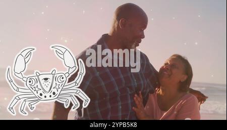 Image of horoscope symbol over happy senior biracial couple dancing at beach Stock Photo