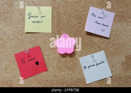 Colorful sticky notes with love messages on a corkboard Stock Photo