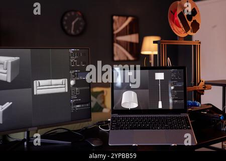 Workspace featuring computer screens displaying 3D designs for furniture, showing advanced modeling software with a 3D printer in background creating intricate objects Stock Photo