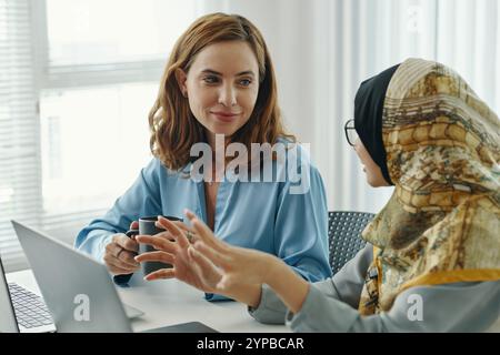 Collaborating with Colleague in Modern Office Setting Stock Photo