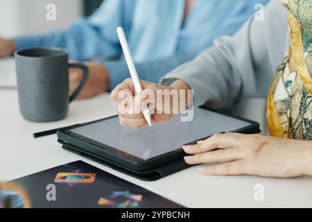 Using Stylus on Tablet for Digital Artwork in Office Stock Photo