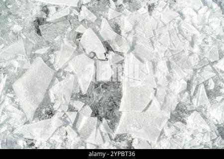 A white background with a lot of broken ice. The ice is in many different shapes and sizes Stock Photo