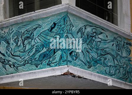 Artwork, painted in 2000, by the Italian artist Vincenzo Eulisse (1936 - 2024) whose works explore political and environmental themes.  On the façade of an ancient property in Piazza delle Erbe in Bolzano (Bozen), Trentino-Alto Adige, Italy. Stock Photo
