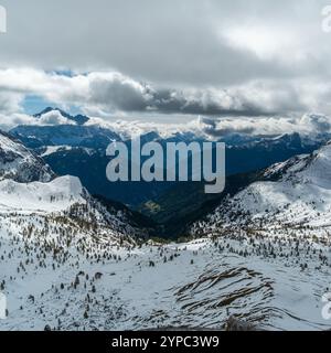 Snow-covered Dolomite mountains span the horizon in a panoramic spectacle of tranquility and alpine majesty Stock Photo