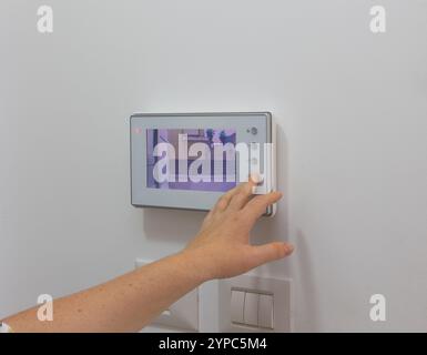 Technical Maintenance and Setup of a Home Intercom System Stock Photo