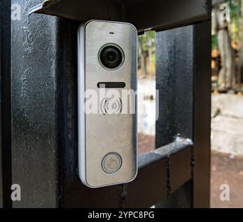 Video intercom in a metal case on the gate Stock Photo