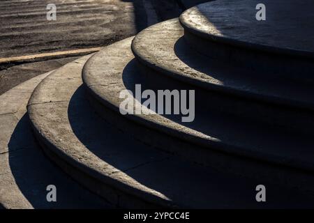 Curved concrete steps. Circular steps concrete in Brazil. Outdoor steps. Abstract steps in the city, Nobody copy space Stock Photo