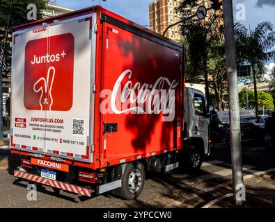 Marilia, Sao Paulo. Brazil, March 08, 2024. Coca-Cola urban cargo transport truck, distributed by the Mexican company FEMSA, stopped at a traffic ligh Stock Photo