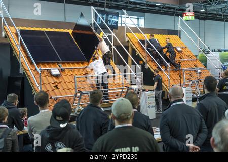 Presentation of the rapid installation of a solar system on a residential house with a pitched roof, in the form of a competition, European Solar Game Stock Photo