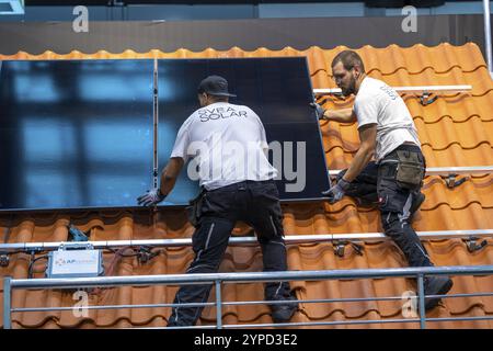 Presentation of the rapid installation of a solar system on a residential house with a pitched roof, in the form of a competition, European Solar Game Stock Photo